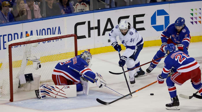 New York Rangers goaltender Igor Shesterkin (31) deflects a shot as center Barclay Goodrow (21) and defenseman Jacob Trouba (8) look to control the rebound against Tampa Bay Lightning left wing Pat Maroon (14) in Game 5 of the NHL Hockey Stanley Cup playoffs Eastern Conference Finals, Thursday, June 9, 2022, in New York.